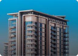 Modern glass apartment building on a sunny day