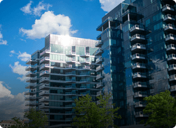 Modern glass apartment building on a sunny day